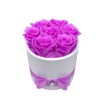 7 purple roses in ceramic vase